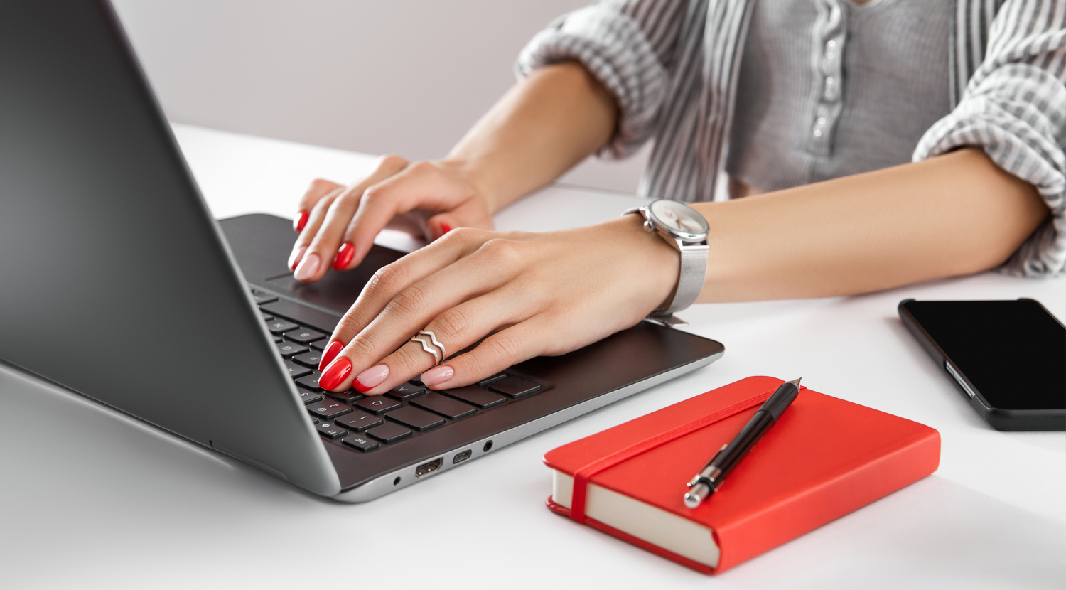 stock-photo-woman-with-red-manicure-work-with-laptop-on-white-table-business-lady-work-from-home-1959311983