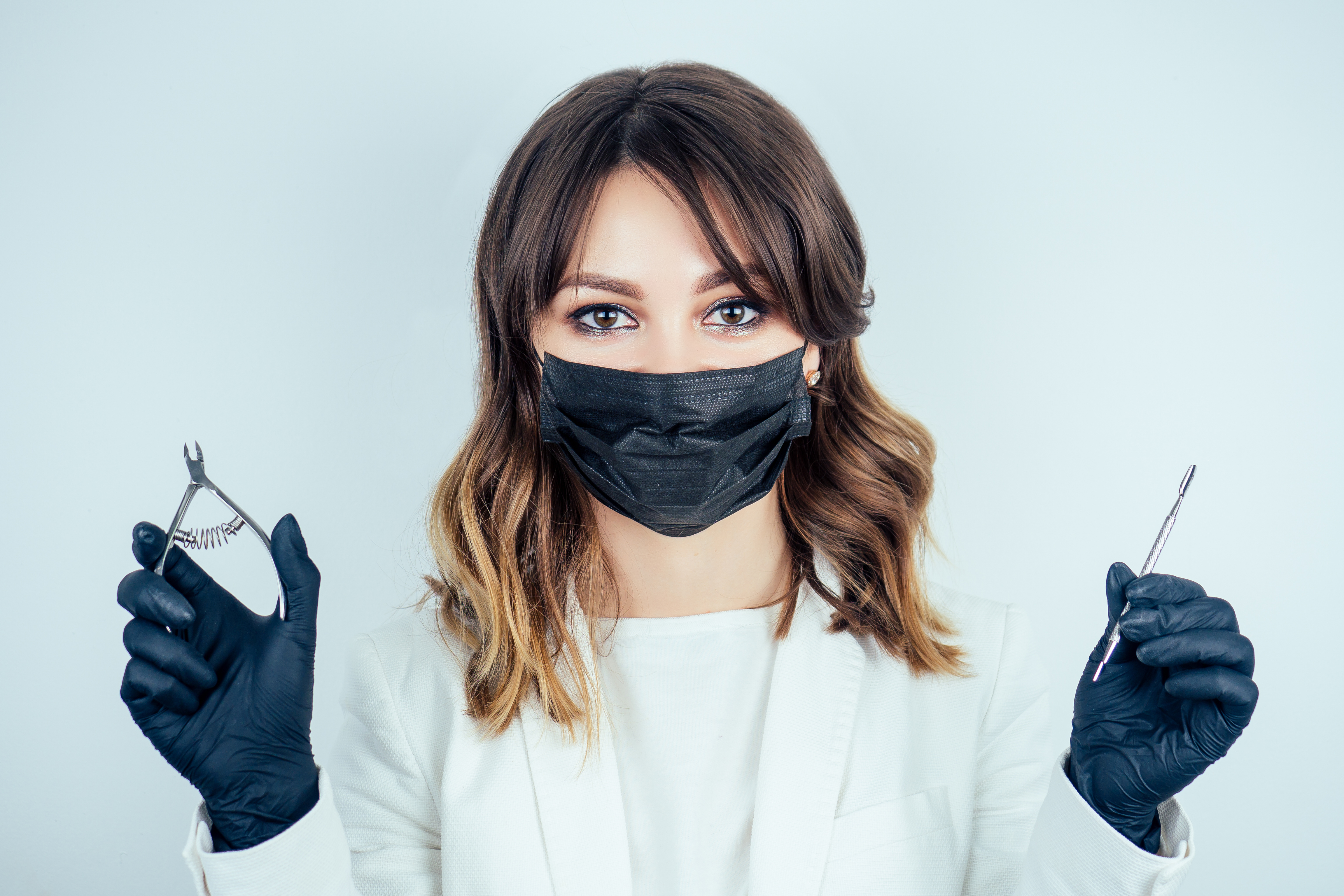 stock-photo-young-attractive-manicurist-professional-master-of-manicure-woman-in-a-white-jacket-mask_shutterstock_1114976744